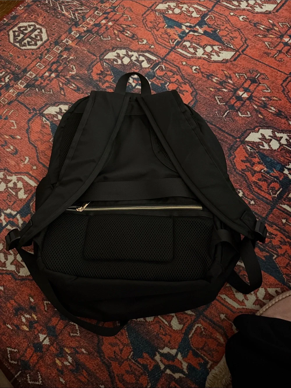 Black Quilted Men's Backpack with Gold Accents